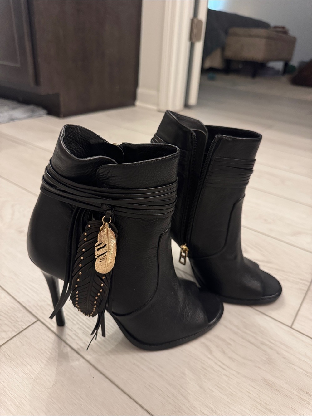 Coach Women's Black Leather Ankle Boots with Decorative Feather Charm